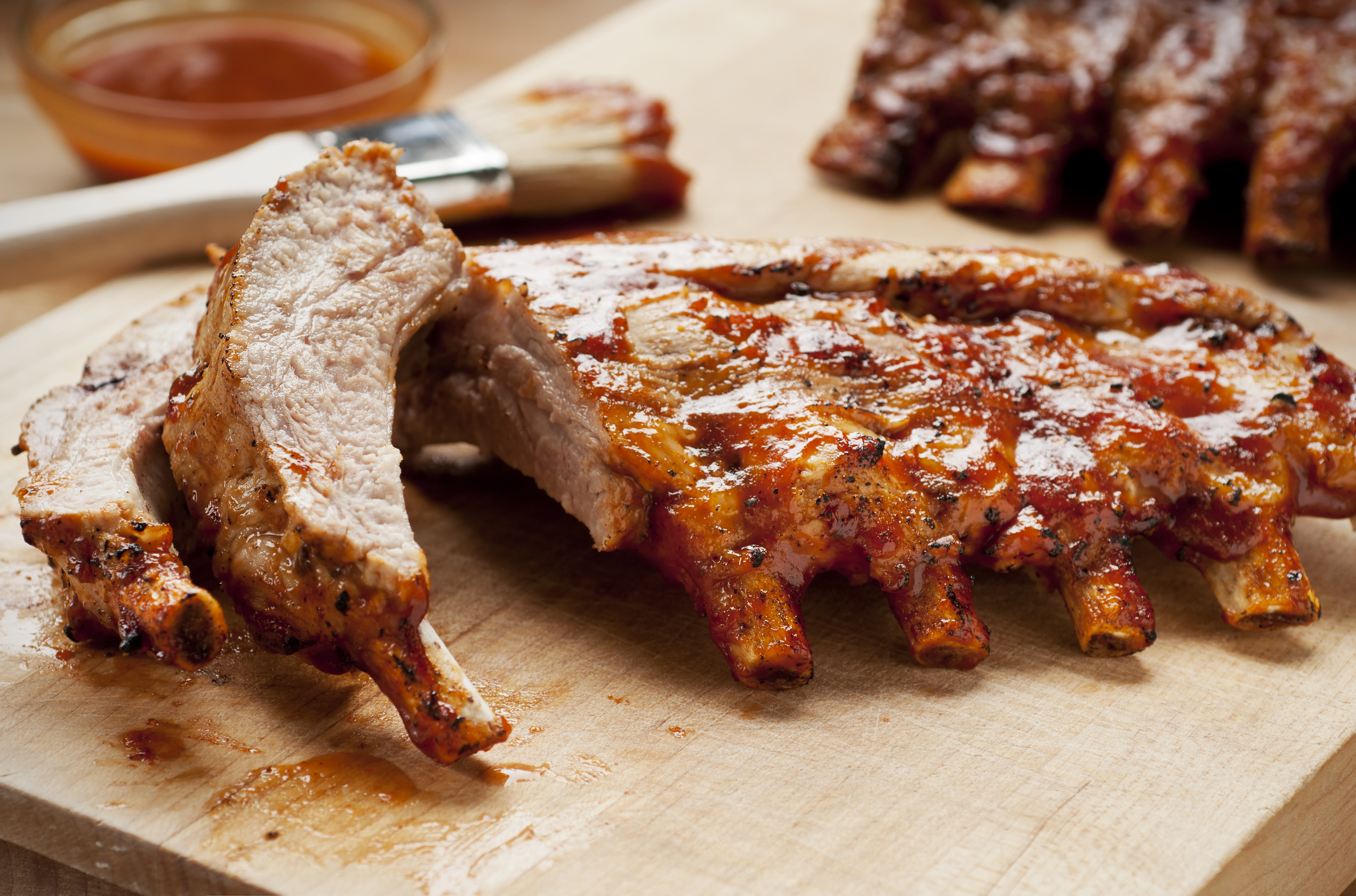 glazed baby back ribs on cutting board