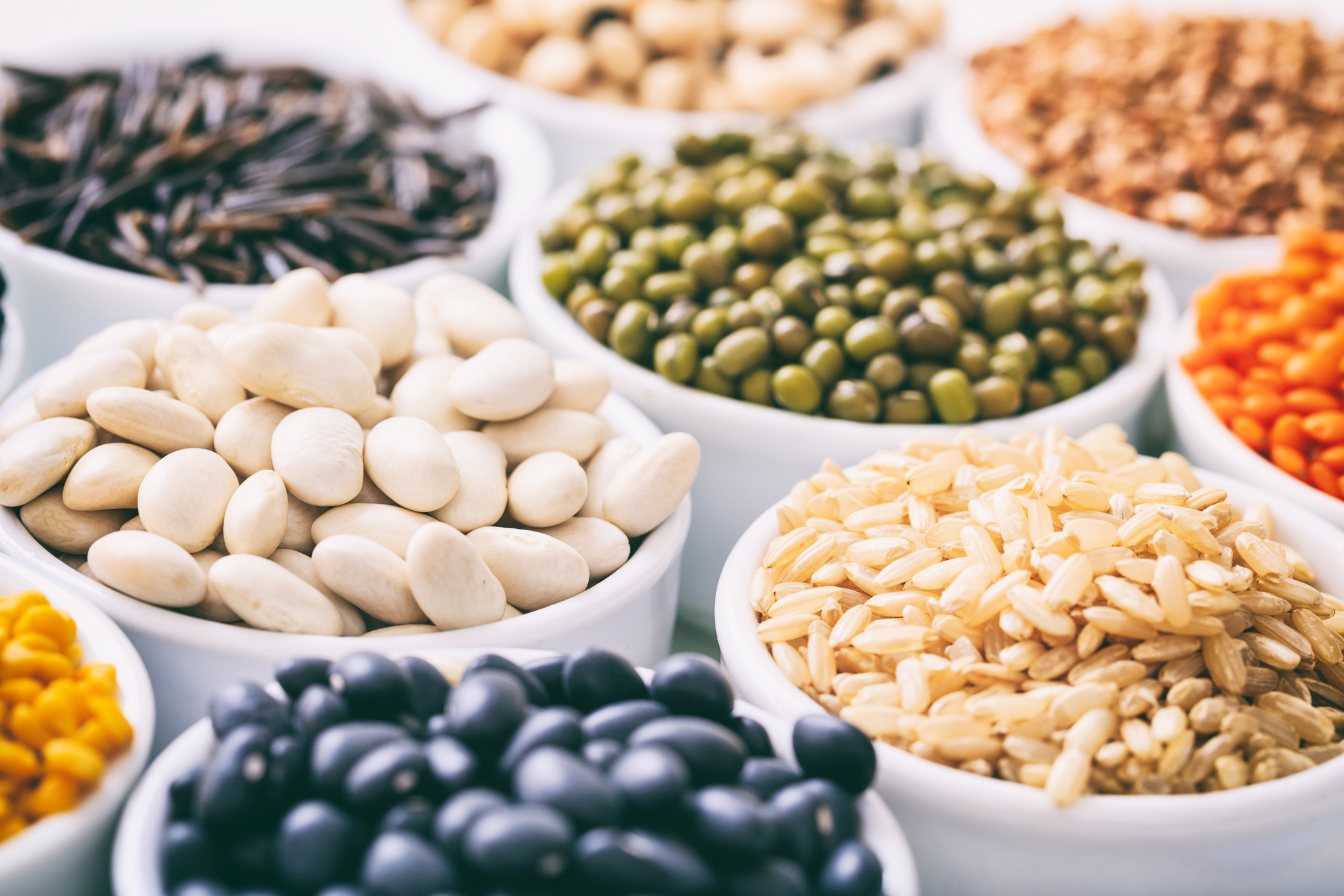 assorted legumes in small bowls