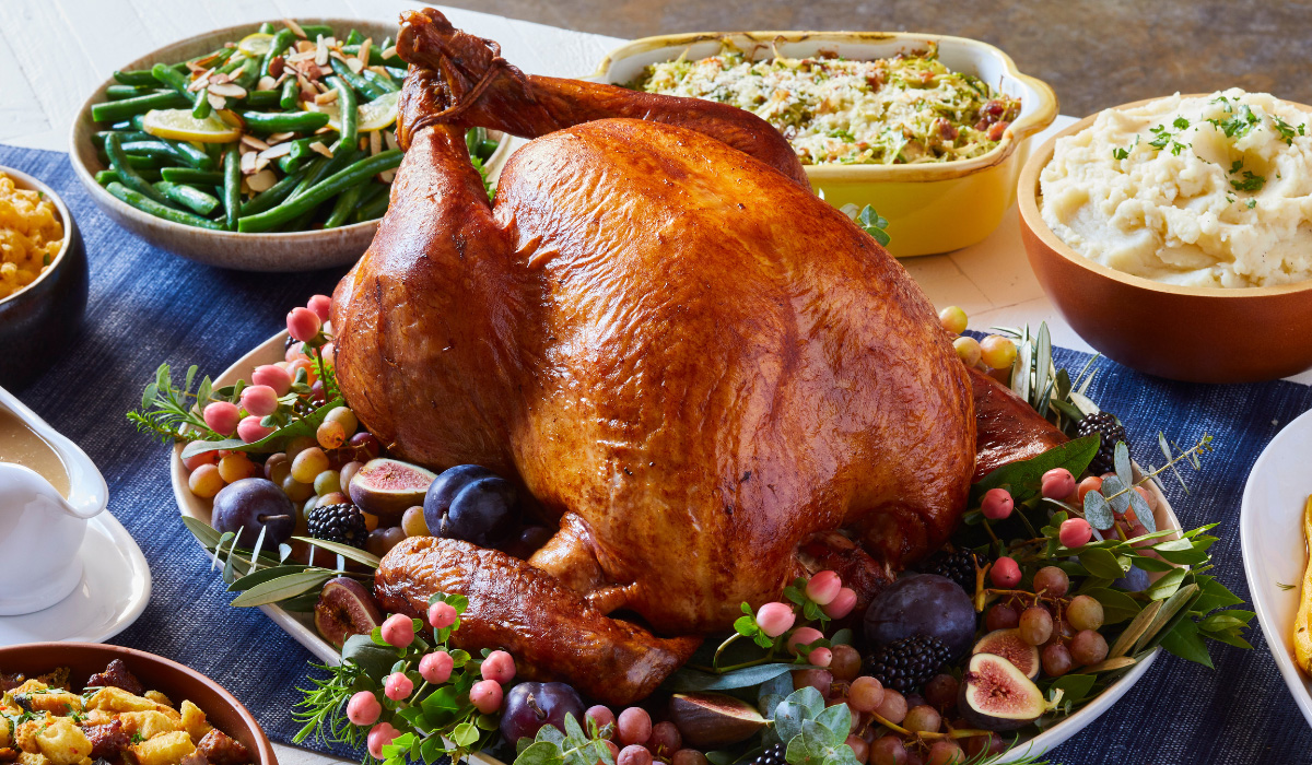 cooked turkey served on platter with sides