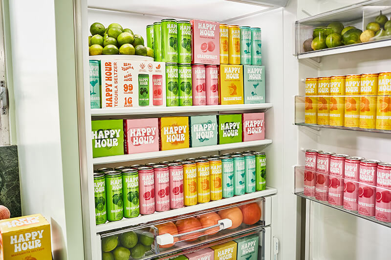 Fridge stocked with Happy Hour seltzers