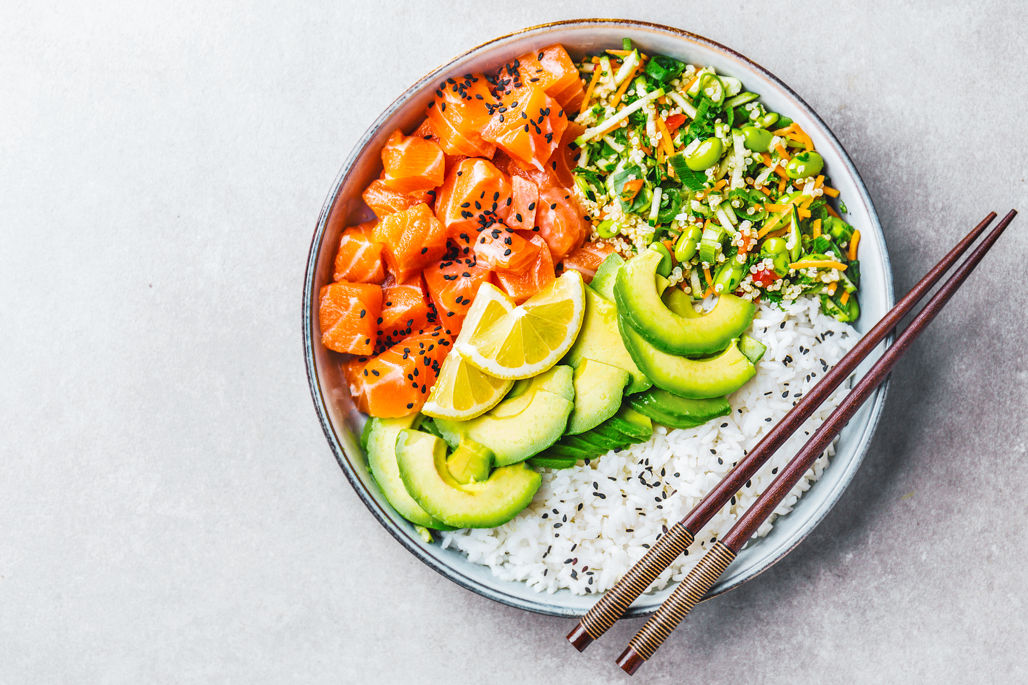 bowl of trout with lime and chopsticks