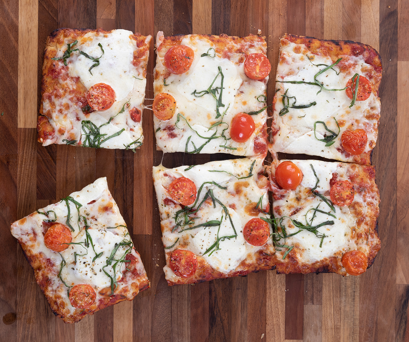 pizza slices on cutting board